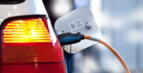 Electric car plugged into EV charger after professional installation in Palm Springs, CA