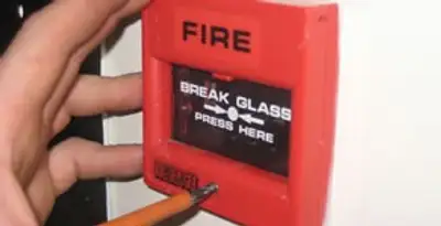 fire alarm installation service showing manual fire alarm pull station installed by licensed electricians in Palm Springs, CA