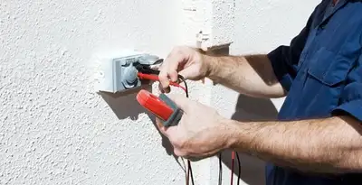 Electrician performing home electrical outlet and wiring inspection in Palm Springs, CA