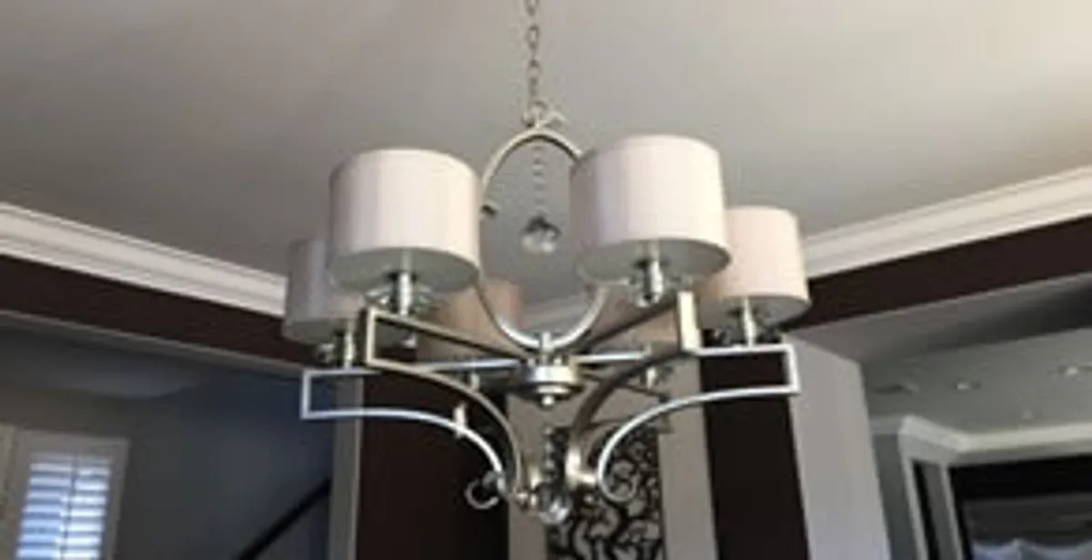 Modern chandelier installation with multiple light fixtures in Palm Springs, CA
