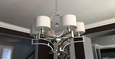 Modern chandelier installation with multiple light fixtures in Palm Springs, CA