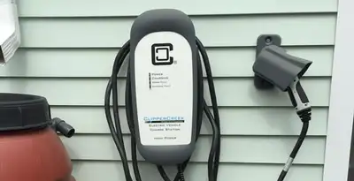 Outdoor electric vehicle charger installation on residential wall in Palm Springs, CA