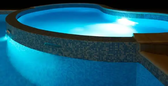pool light installation and repair services highlighting illuminated pool interior lighting in Palm Springs, CA