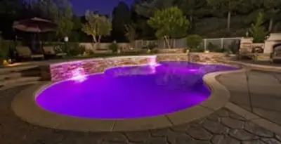 pool light installation and repair services illuminating a residential swimming pool in Palm Springs, CA