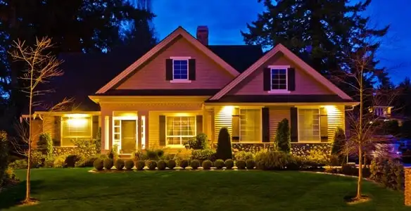 security light installation services illuminating a residential exterior at night in Palm Springs, CA