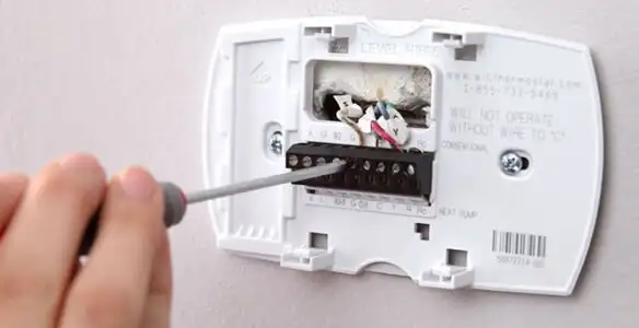 Thermostat installation service with proper wiring and secure wall mounting in Palm Springs, CA